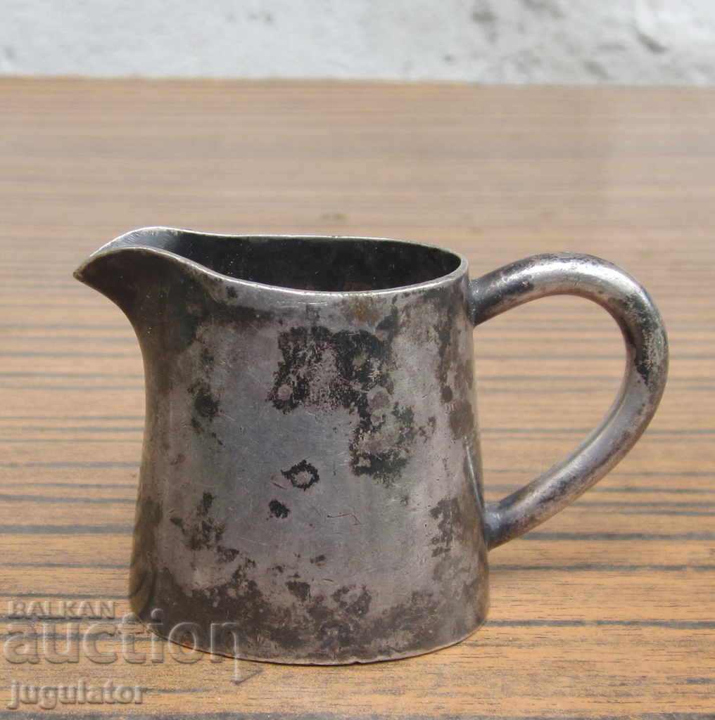 an old marked German small silver-plated milk jug