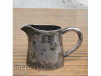 an old marked German small silver-plated milk jug