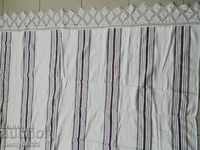 An old hand-woven bed sheet with a lace kenar