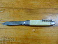 Un cuțit antichizat de buzunar german