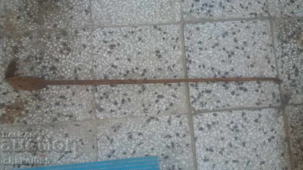 An old wrought iron fireplace mantel An old wrought iron fireplace mantel