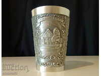 Engraved cup of tin.