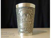 Engraved pewter cup.