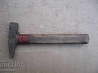 Old hammer, wooden handle