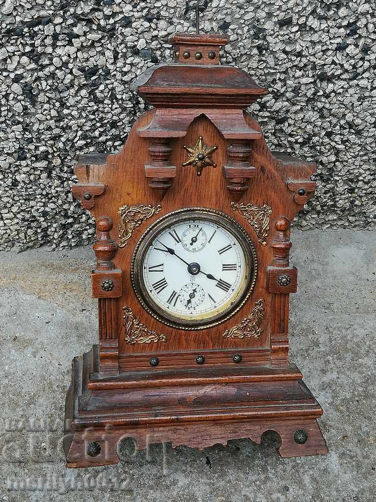 An old desk clock with an excellent dial, an alarm clock, a joker