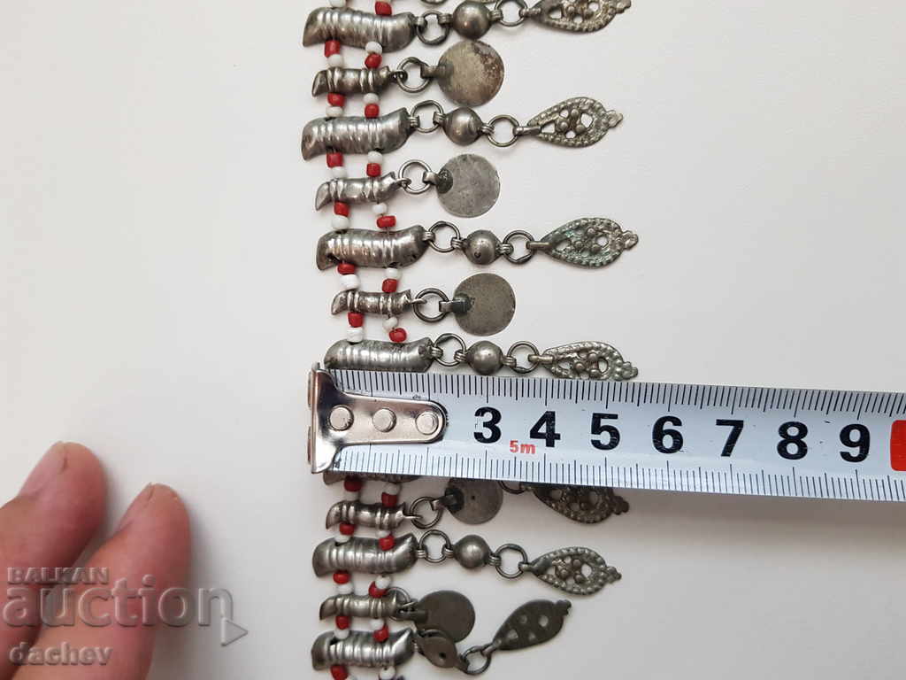 A silver Renaissance reading book flaunts a bejeweled costume - 6