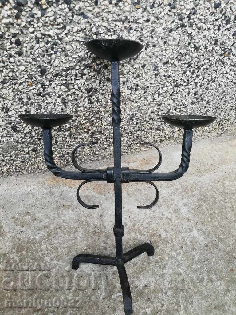 Delivery of Old forged candlestick, candle