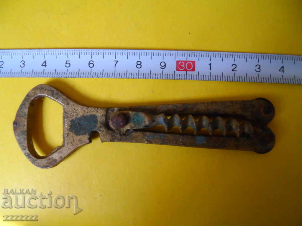 Auction  old bronze opener/corkscrew