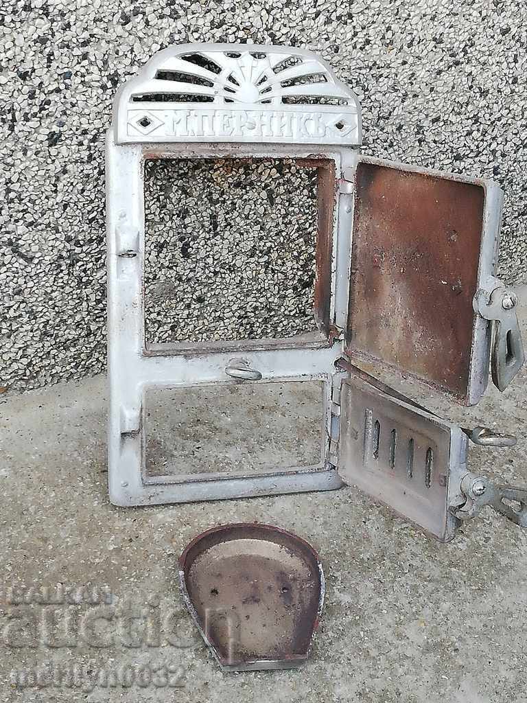 Delivery of Emblem and doors from an old Jamal stove, figured cast iron