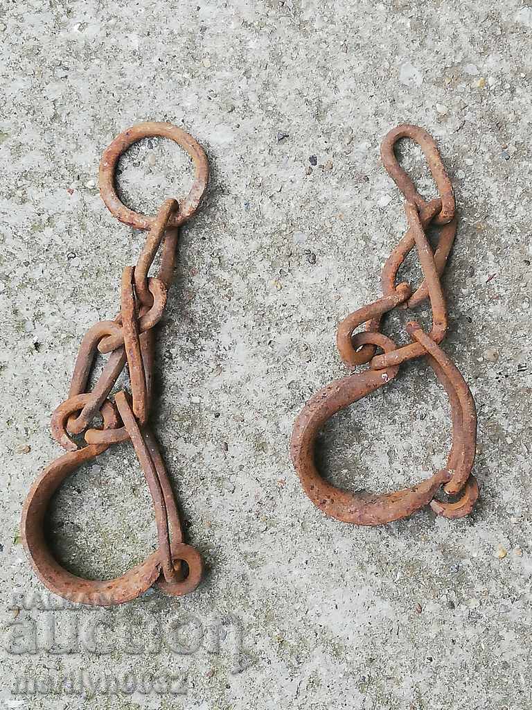 Auction Pair of buckles, shackles, chain, wrought iron Auction Pair of buckles, shackles, chain, wrought iron