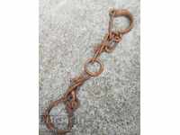 Pair of buckles, shackles, chain, wrought iron