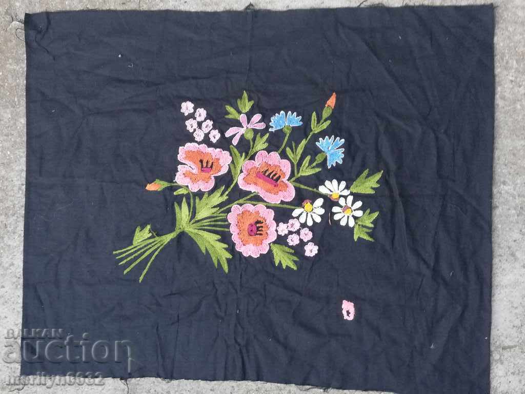 Old embroidered patchwork sewn onto an apron pillow