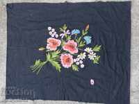 Old embroidered patchwork sewn onto an apron pillow