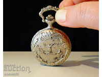 Japanese pocket watch with hunting scenes.