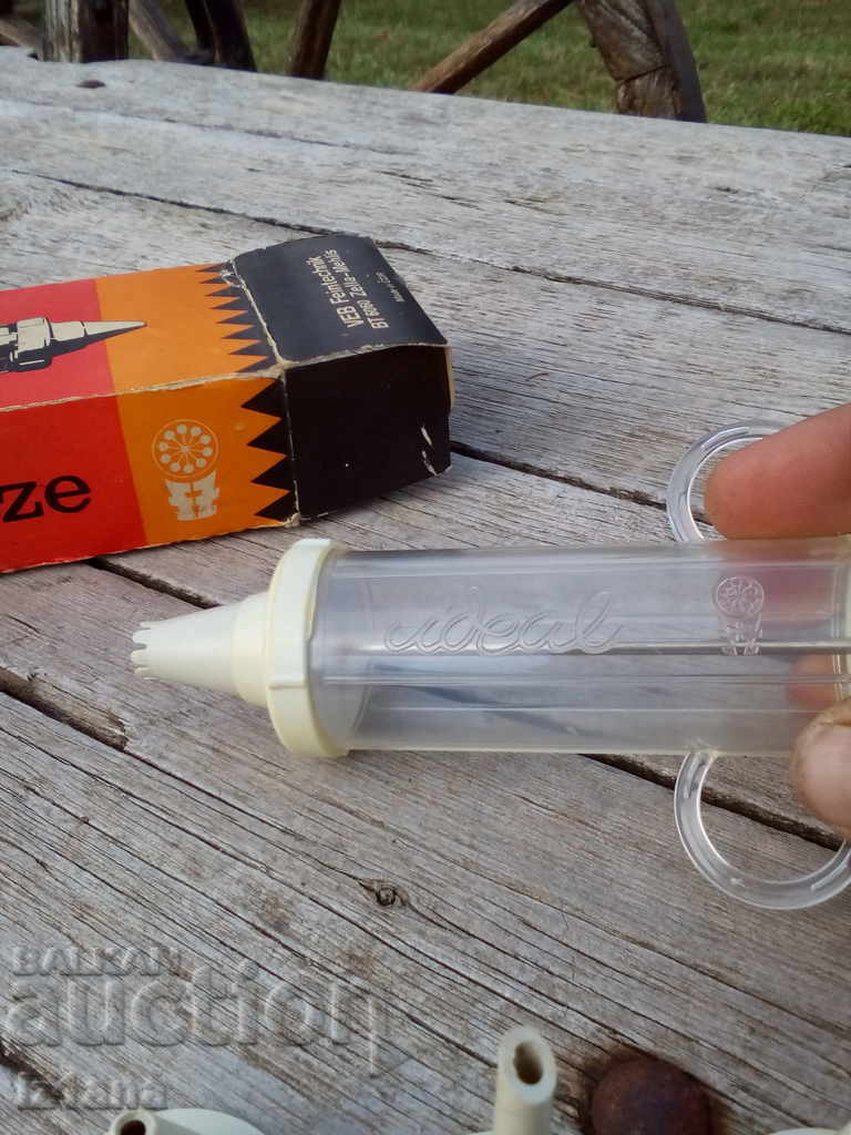 Delivery of An old pastry syringe Delivery of An old pastry syringe