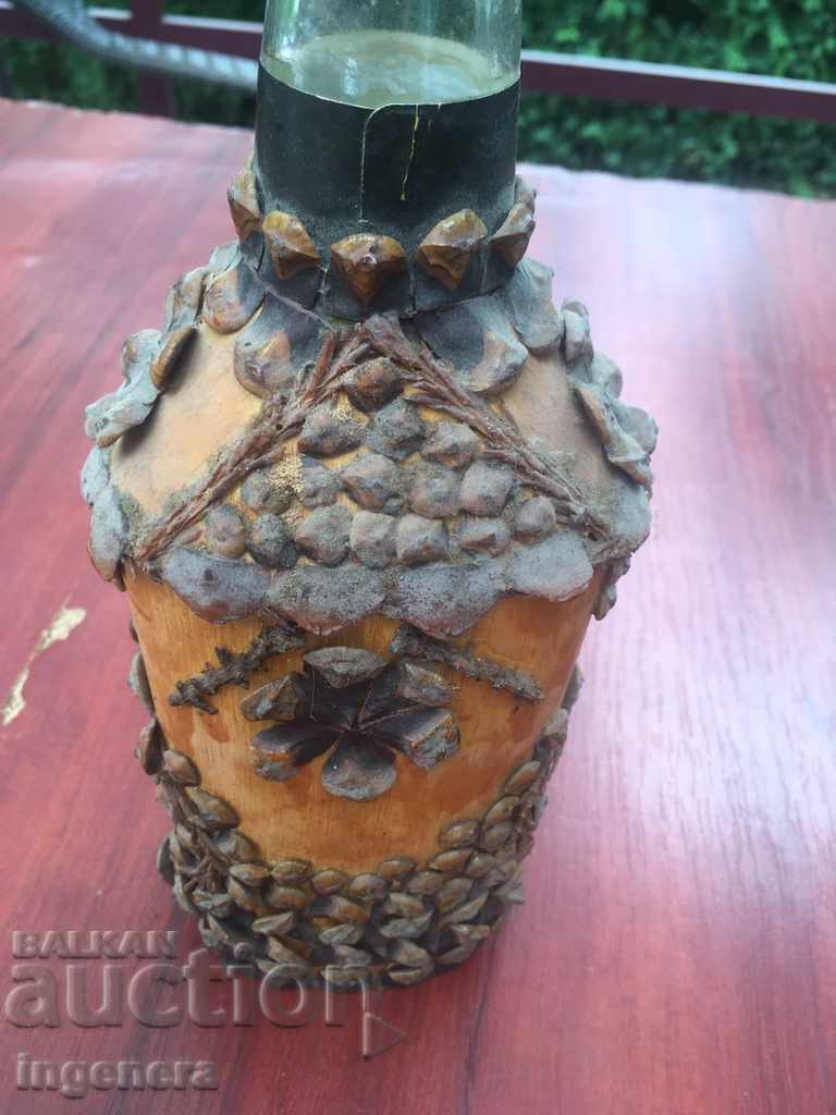 Auction BOTTLE DECORATED WITH PINE CONE SCALES Auction BOTTLE DECORATED WITH PINE CONE SCALES