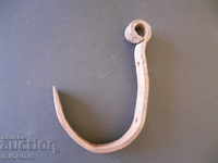 An old forged hook, a crown