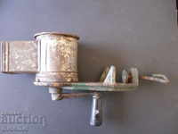 An old grinder marked