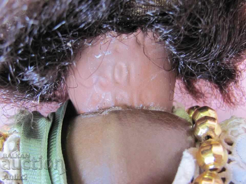 Delivery of Antique doll marked