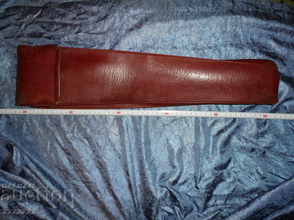 A large, old leather case.