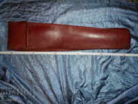 A large, old leather case.