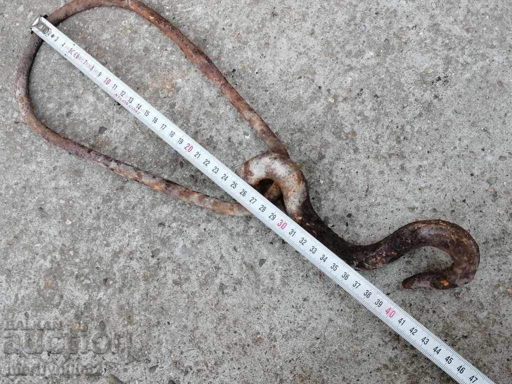 Delivery of An old forged hook with a ring, a cogger, an anchor wrought iron Delivery of An old forged hook with a ring, a cogger, an anchor wrought iron