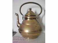 A large and beautiful bronze teapot