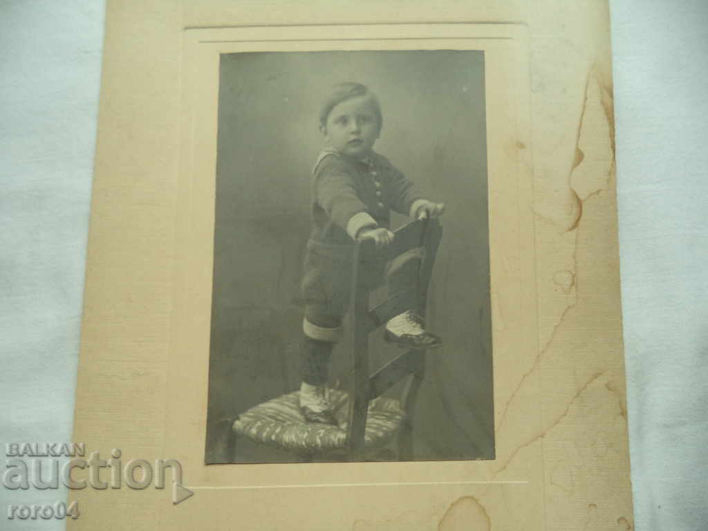 JUST BEFORE HE FALLS FROM THE CHAIR