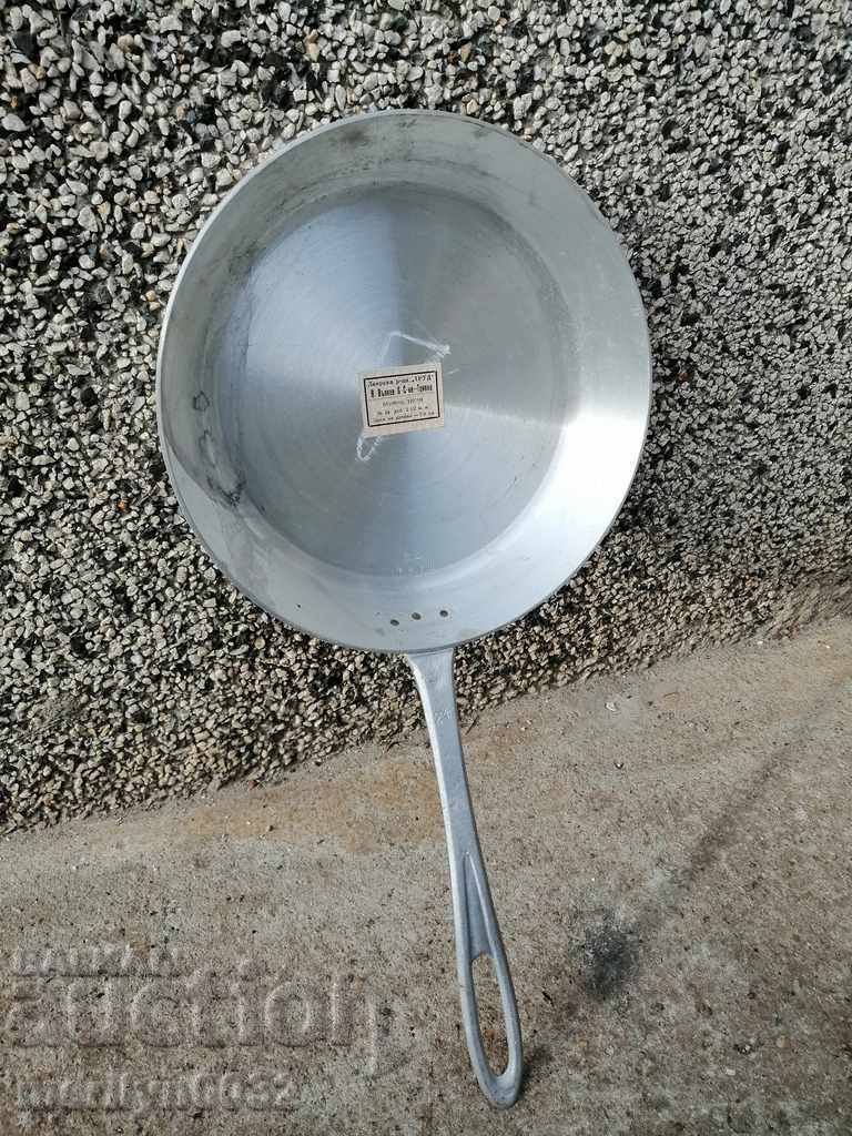 Old 1946 aluminum pan labeled kitchenware