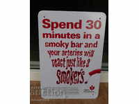 Metal sign for 30 minutes in a bar with smokers and arteries ..