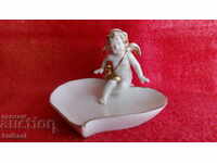 Old porcelain figure Angel Heart of golden edges