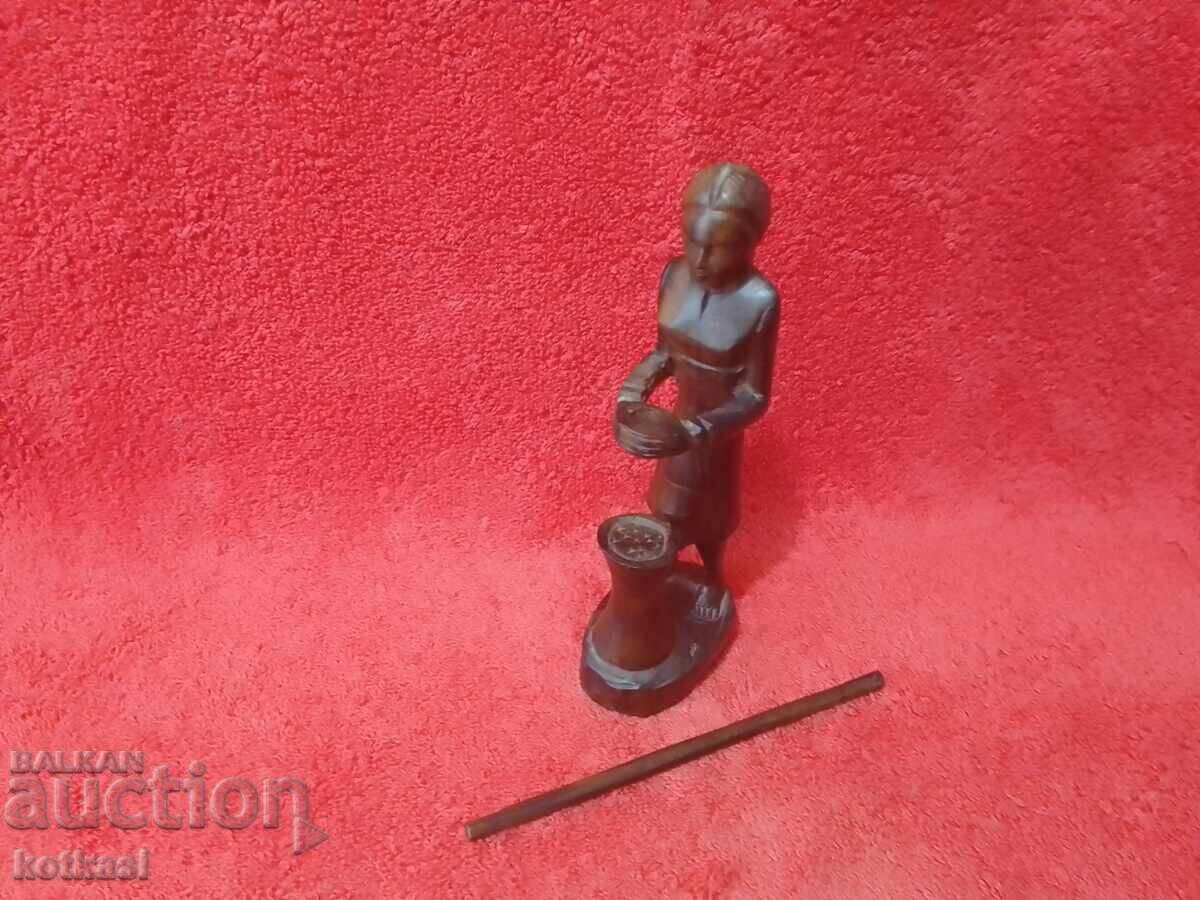Delivery of Old wood carving figure of a woman mother with child working Delivery of Old wood carving figure of a woman mother with child working