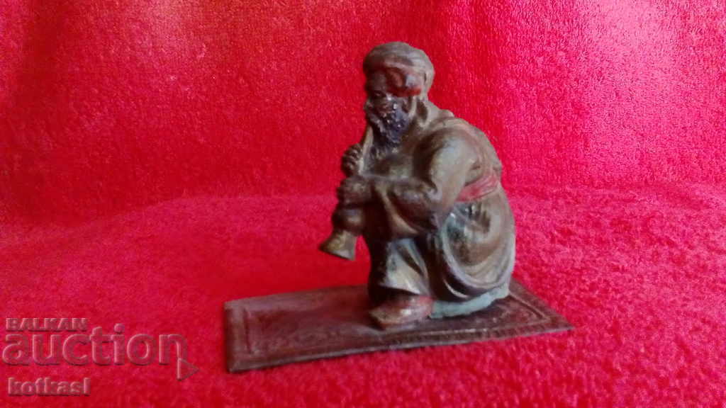 Old metal bronze figure of Musician Austria