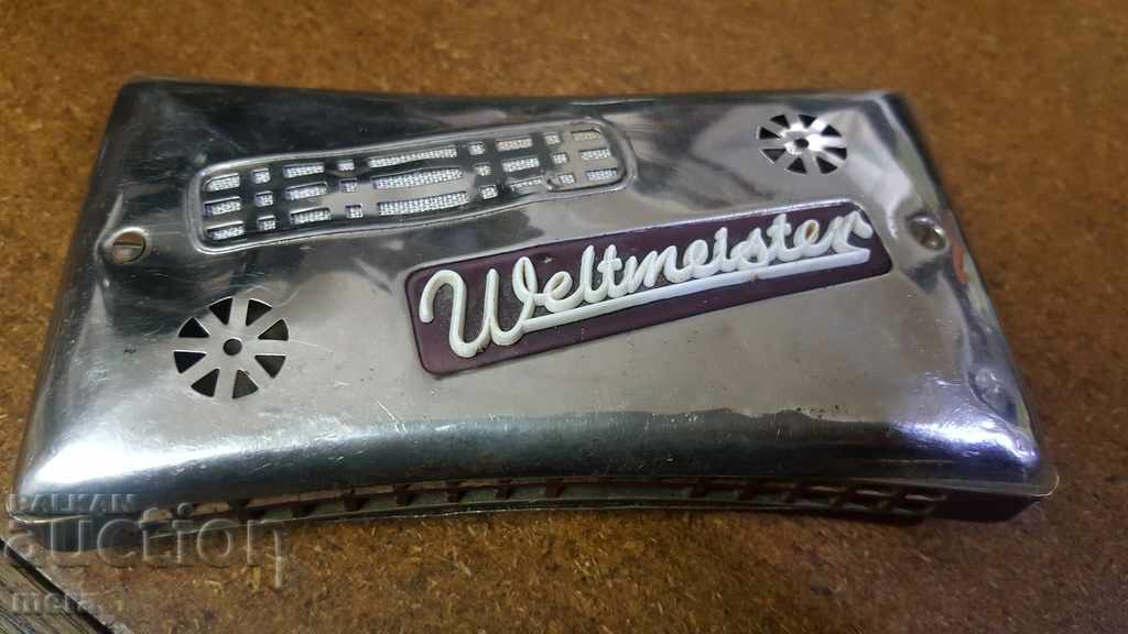Ancient two-sided harmonica Weltmeister