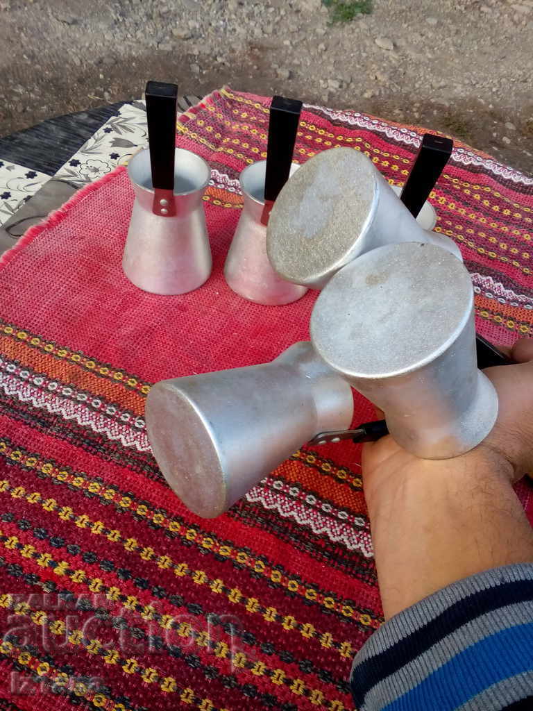 Delivery of Old cezve, cezve for Turkish coffee on sand Delivery of Old cezve, cezve for Turkish coffee on sand