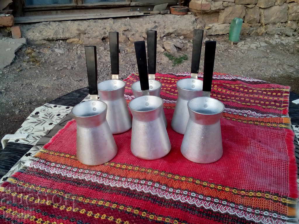 Old cezve, cezve for Turkish coffee on sand Old cezve, cezve for Turkish coffee on sand