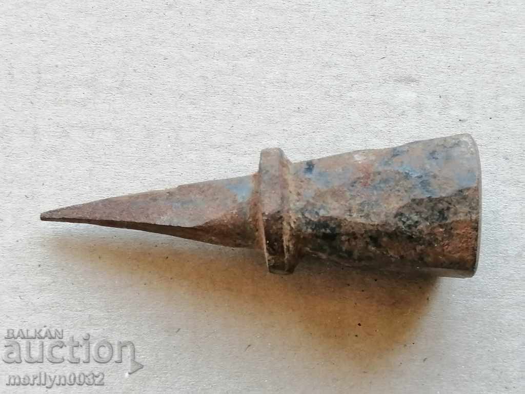 Auction A primitive anvil for pinning hair Auction A primitive anvil for pinning hair