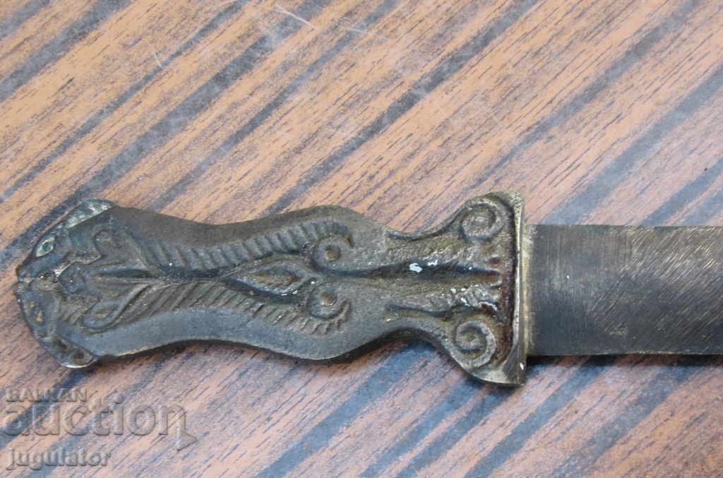 Delivery of old antique bronze knife for letters with ornaments