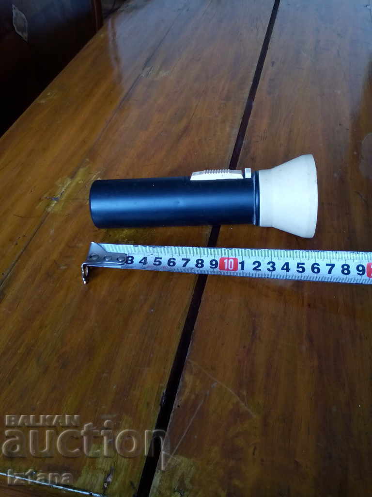 Auction  An old magnetic lantern, an Artas flashlight