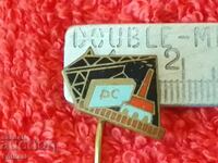 Old solid bronze pin badge Construction Crane