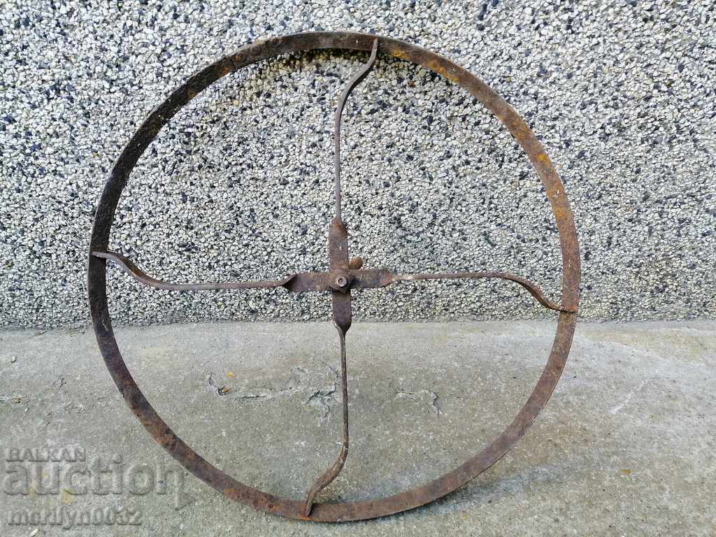 Auction  Wrought Iron Wheel