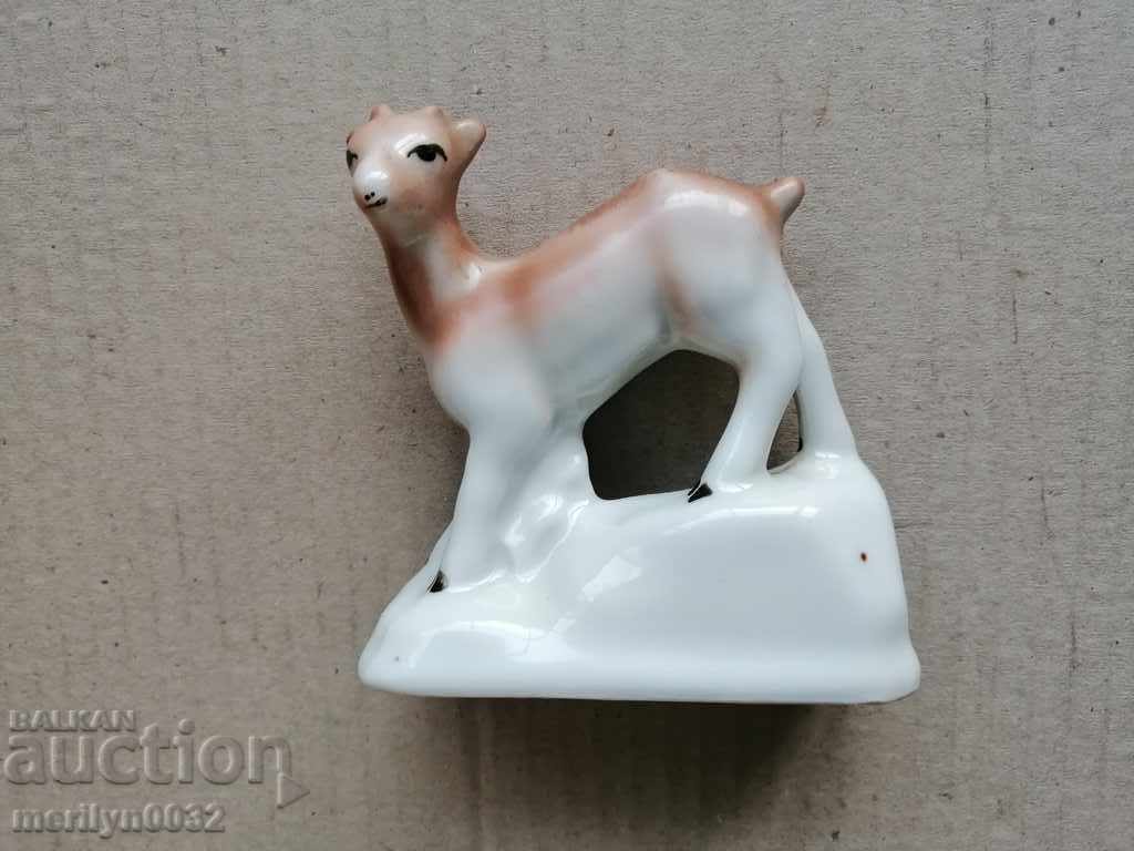 Old porcelain figure, figurine, sculpture, fawn Old porcelain figure, figurine, sculpture, fawn