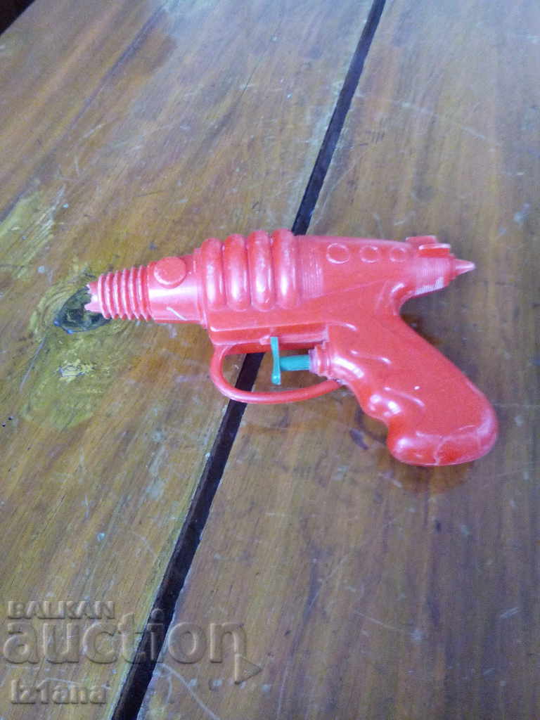 An old water gun, a toy