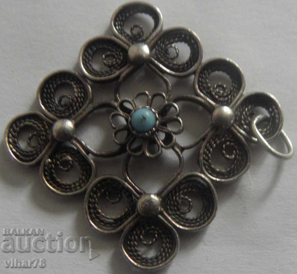 an old very beautiful silver pendant