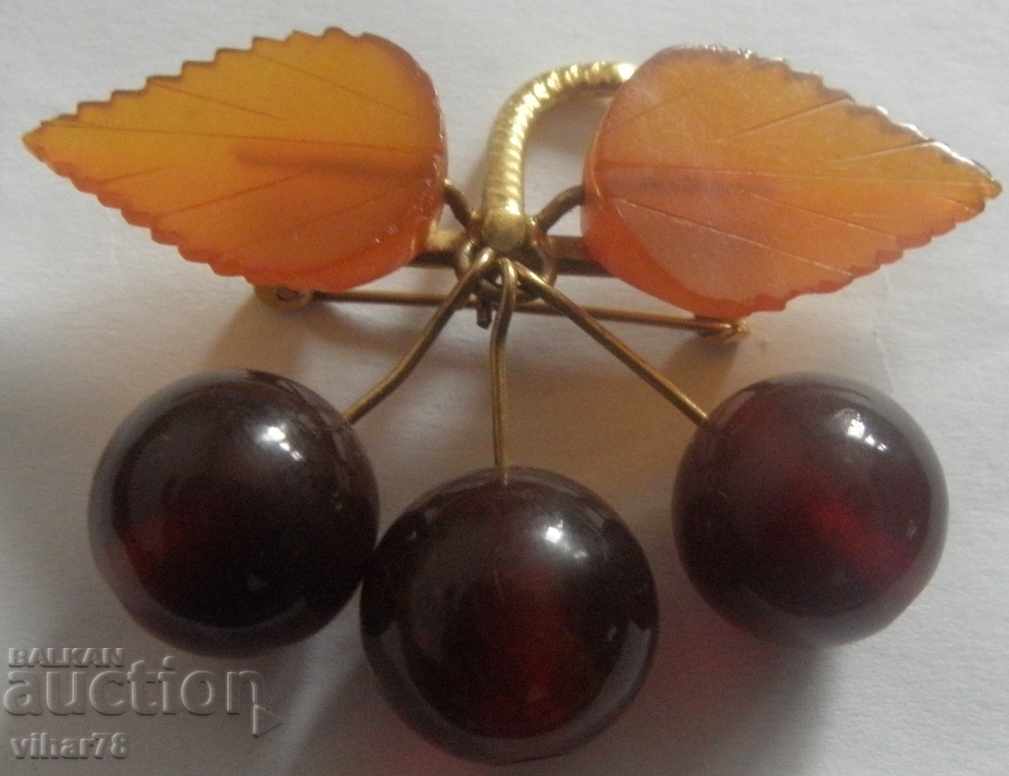 An old amber brooch with two types of amber, gilded