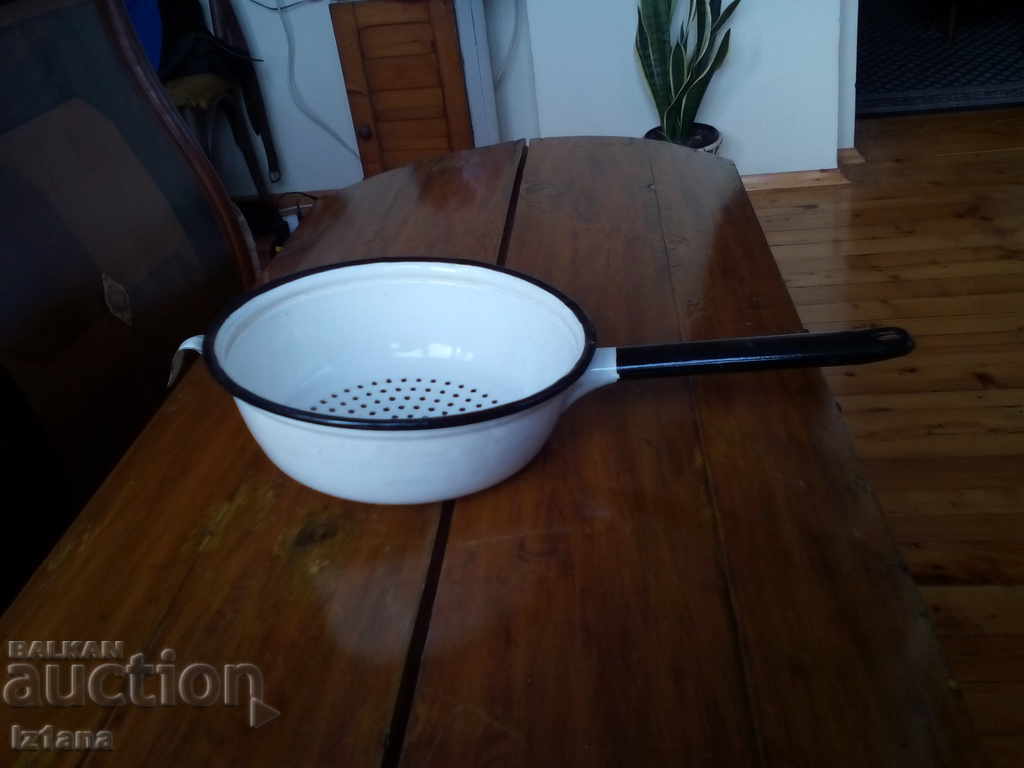Old enameled strainer, colander