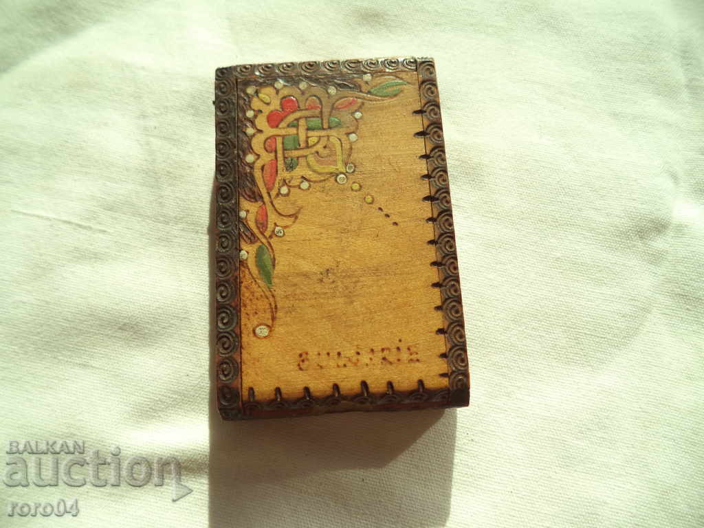 A SMALL OLD WOODEN BOX