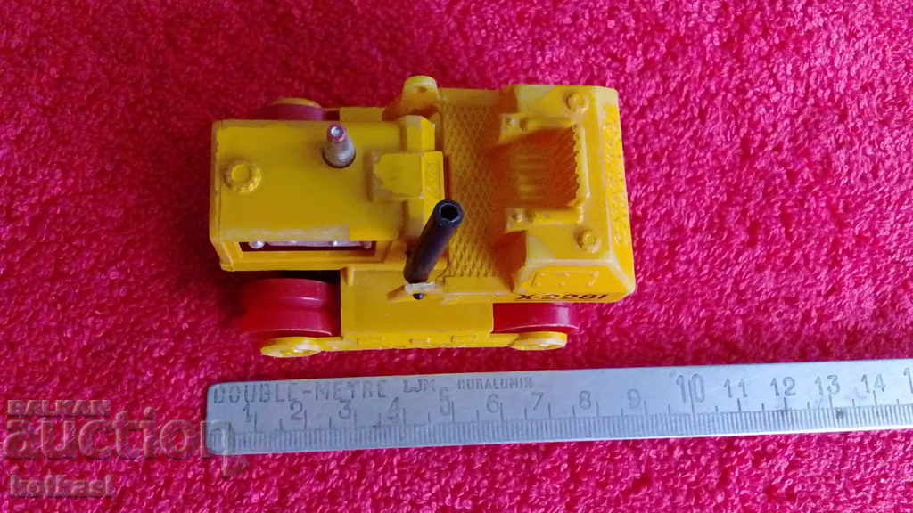 Small plastic toy chain machine marked Greece