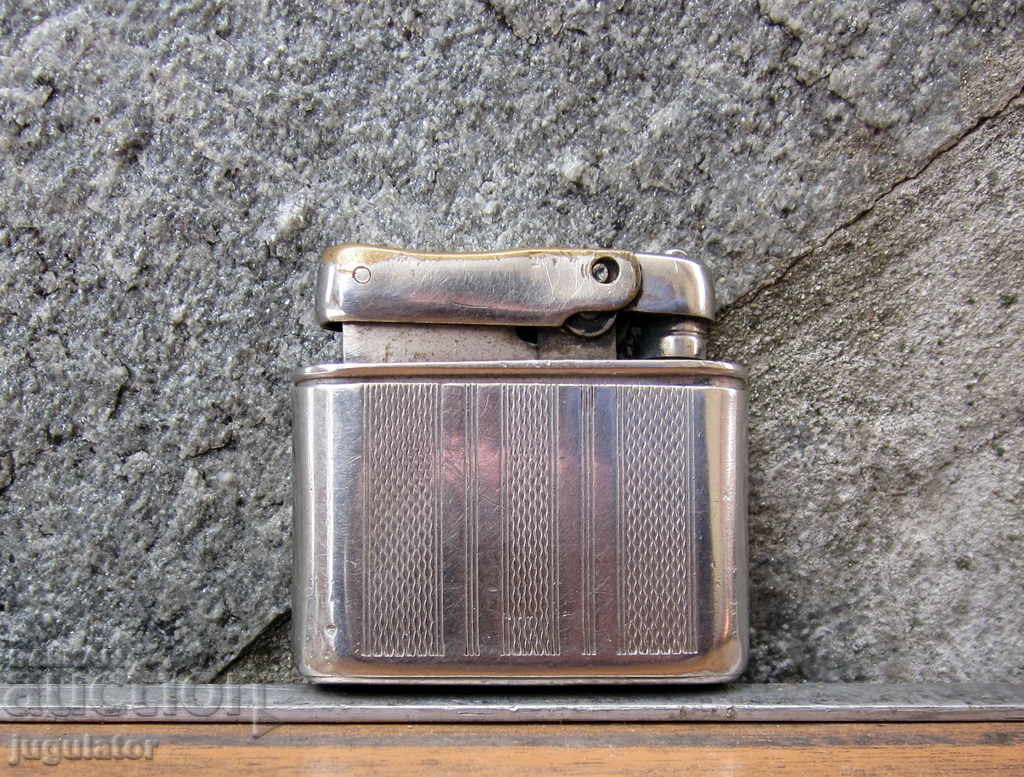 an old gasoline lighter for cars stands JUGOAUTO with price 30.00 BGN | € 15.34 an old gasoline lighter for cars stands JUGOAUTO with price 30.00 BGN | € 15.34
