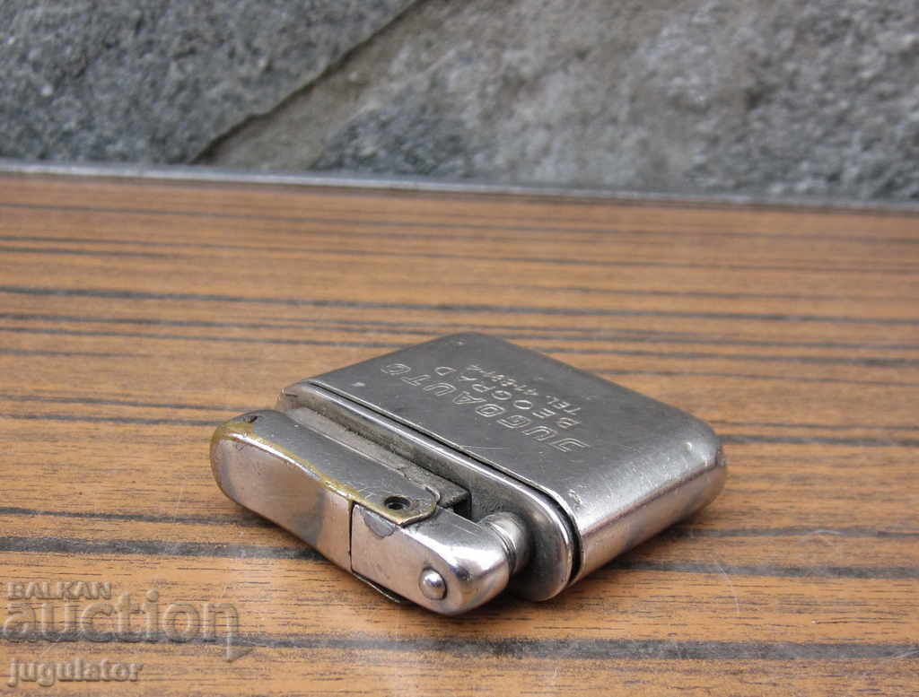 Auction an old gasoline lighter for cars stands JUGOAUTO Auction an old gasoline lighter for cars stands JUGOAUTO
